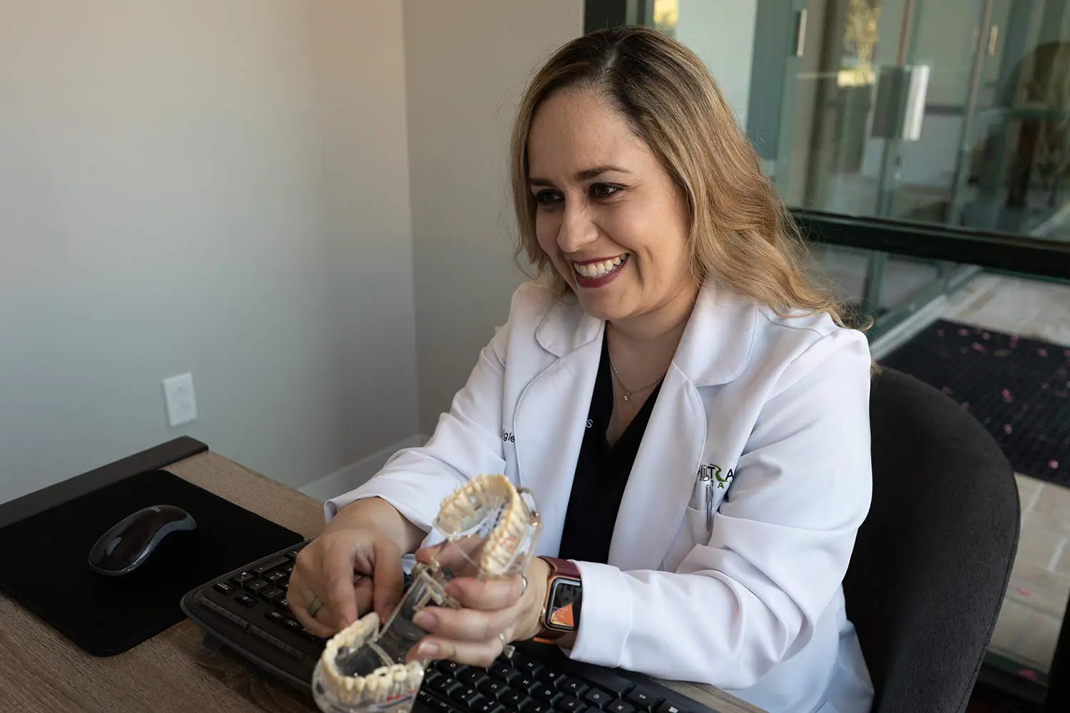 Dr. Daigle showing the benefits of dentures